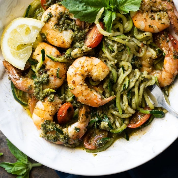 Twirled keto zoodles with pesto, shrimp, lemon & basil