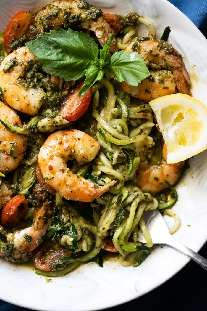 Twirled keto zoodles with pesto, shrimp, lemon & basil