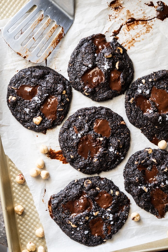 Freshly baked keto chocolate chunk cookies on baking tray