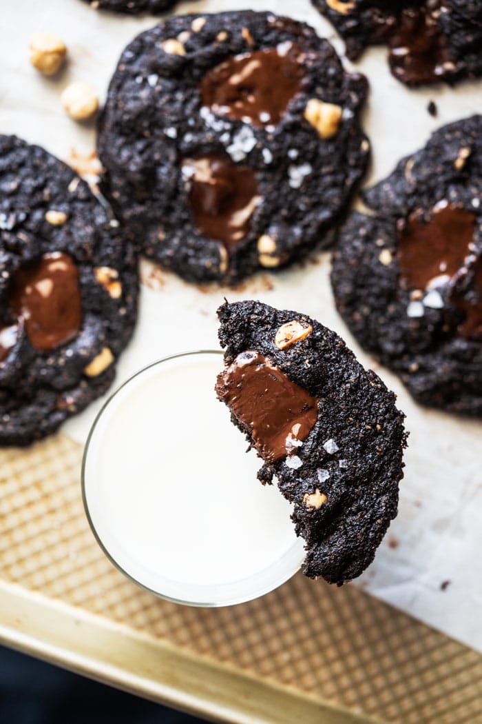 Sugar free chocolate chunk cookie on a glass of milk