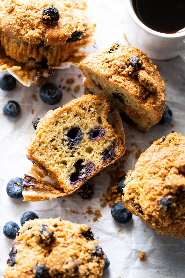 Halved keto blueberry muffin with almond streusel