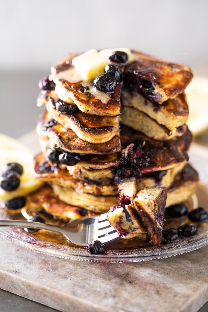 Eating Keto Blueberry pancakes with a fork