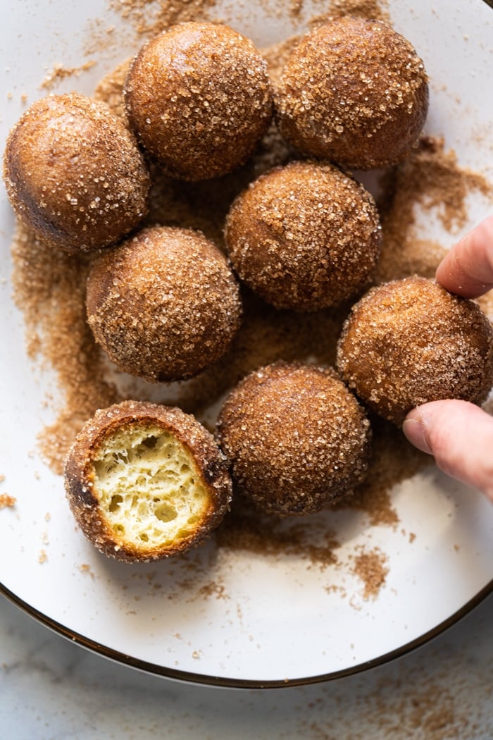 Taking a cinnamon sugar keto donut hole