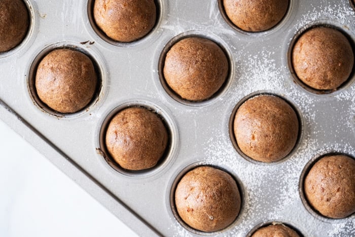 Freshly baked keto donut holes on a doughnut hole pan