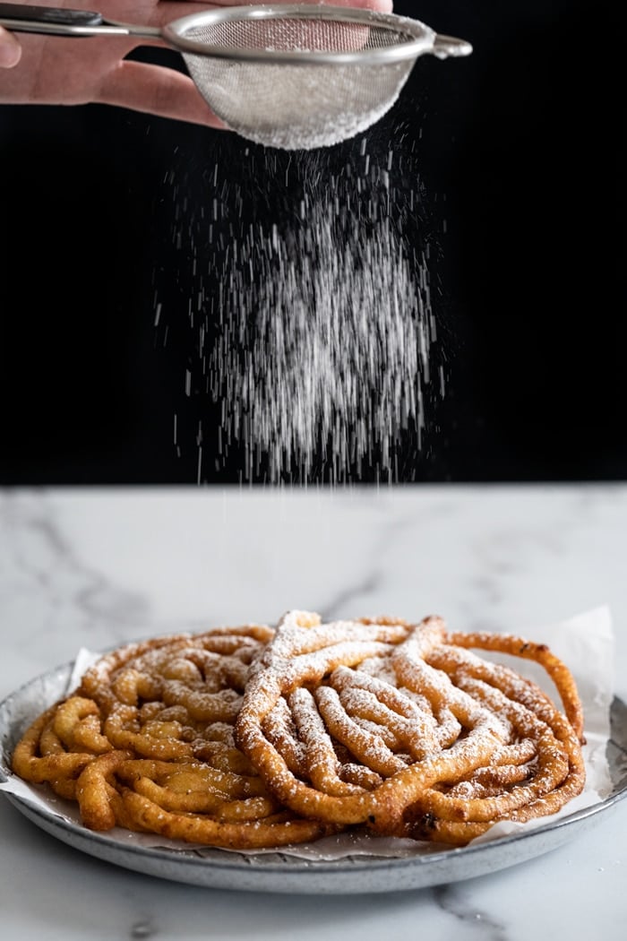 Sprinkling powdered 'sugar' onto keto funnel cakes