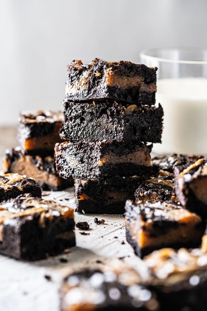 Stacked keto peanut butter brownies with a glass of milk