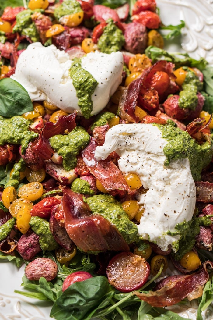 Closeup keto fauxtato salad with radishes, burrata and pesto