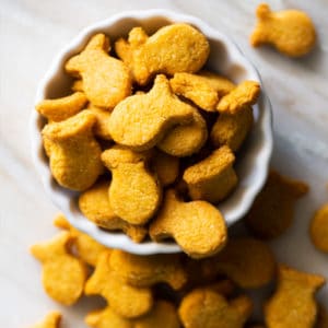 Homemade keto goldfish crackers in a white serving bowl
