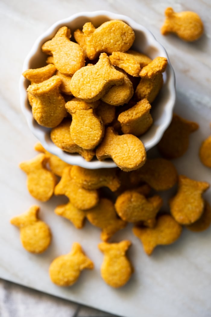 Homemade keto goldfish crackers in a white serving bowl