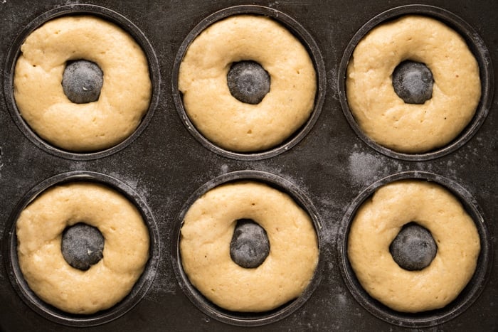 Keto unbaked batter piped onto a donut pan