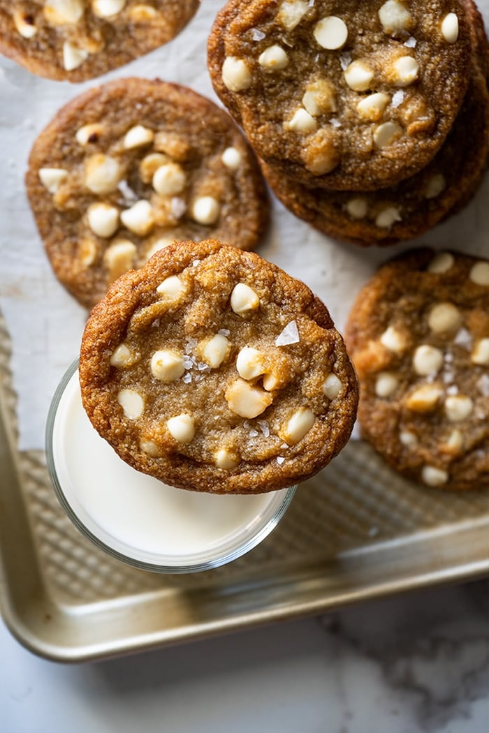 Keto white chocolate macadamia nut cookies with a glass of milk