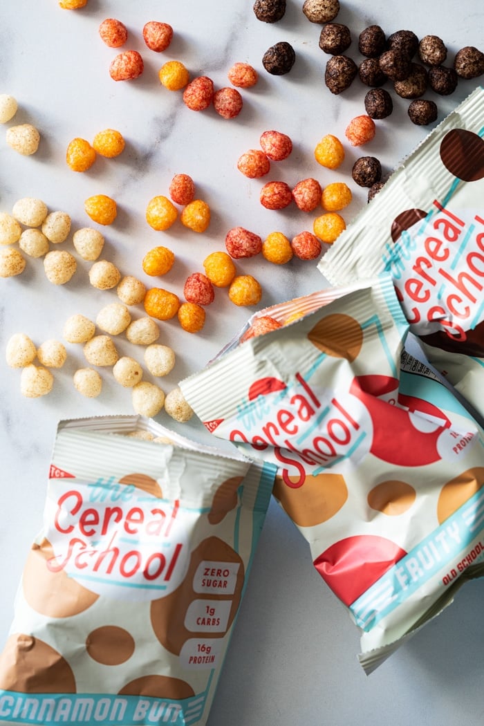 The three flavors of Cereal School on a marble surface