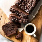 Sliced keto chocolate zucchini bread with a cup of coffee