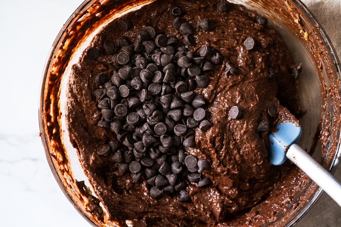 Folding in chocolate chips onto the gluten free and keto chocolate zucchini batter