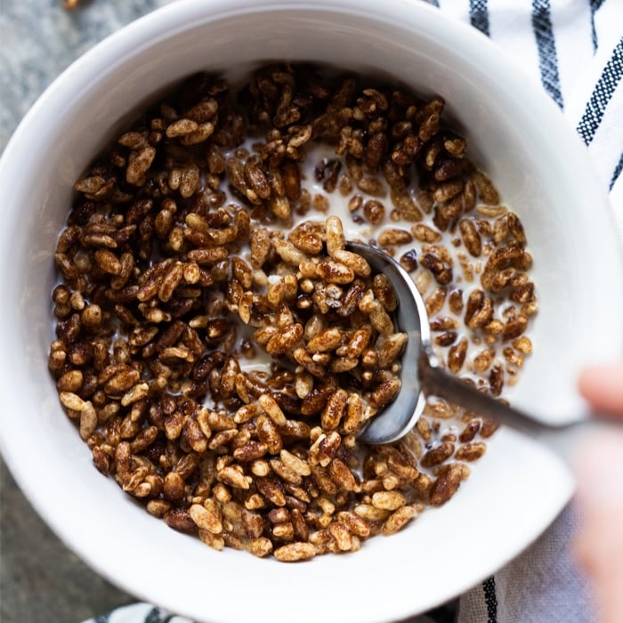 Taking a spoonful of High Key Keto Cereal