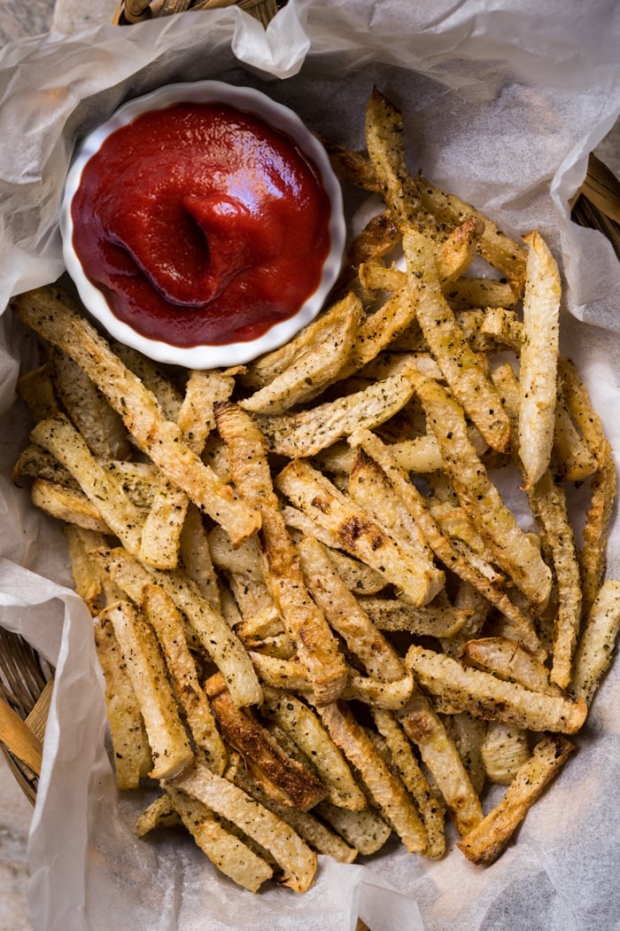 Keto ketchup with jicama fries on a serving tray