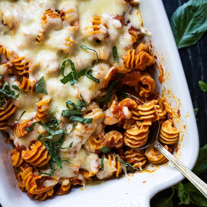 Keto cheesy pasta bake with radiatori in a white baking dish