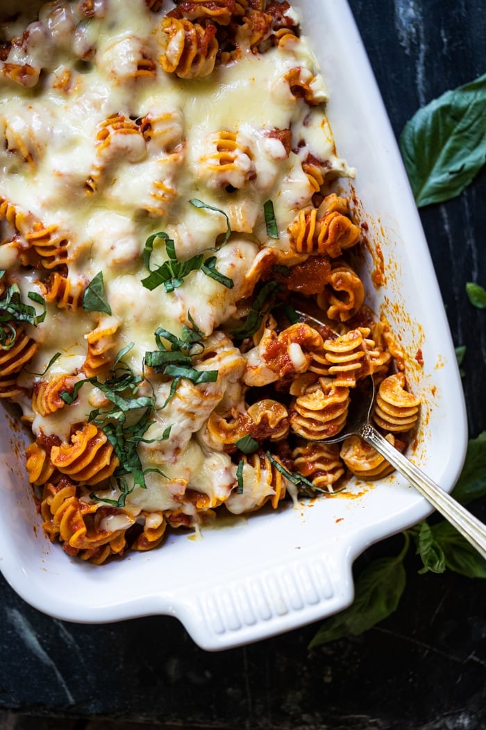 Keto cheesy pasta bake with radiatori in a white baking dish