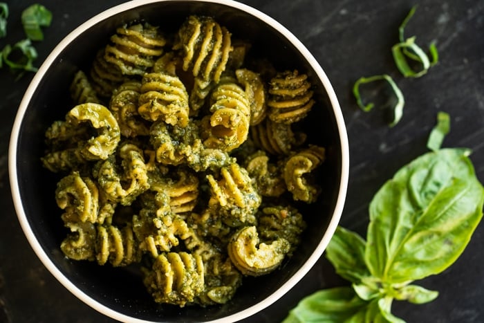 Keto radiatori pasta with pesto sauce and fresh basil