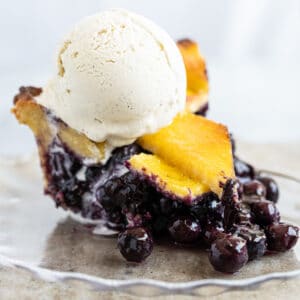 Gluten Free & Keto Blueberry Pie (with a flaky lattice pie crust!) and a scoop of vanilla ice cream on top