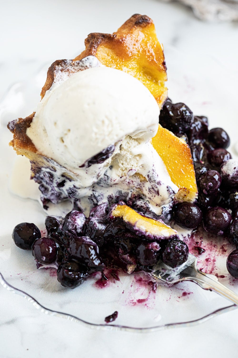 Gluten Free & Keto Blueberry Pie (with a flaky lattice pie crust!) and a scoop of vanilla ice cream on top
