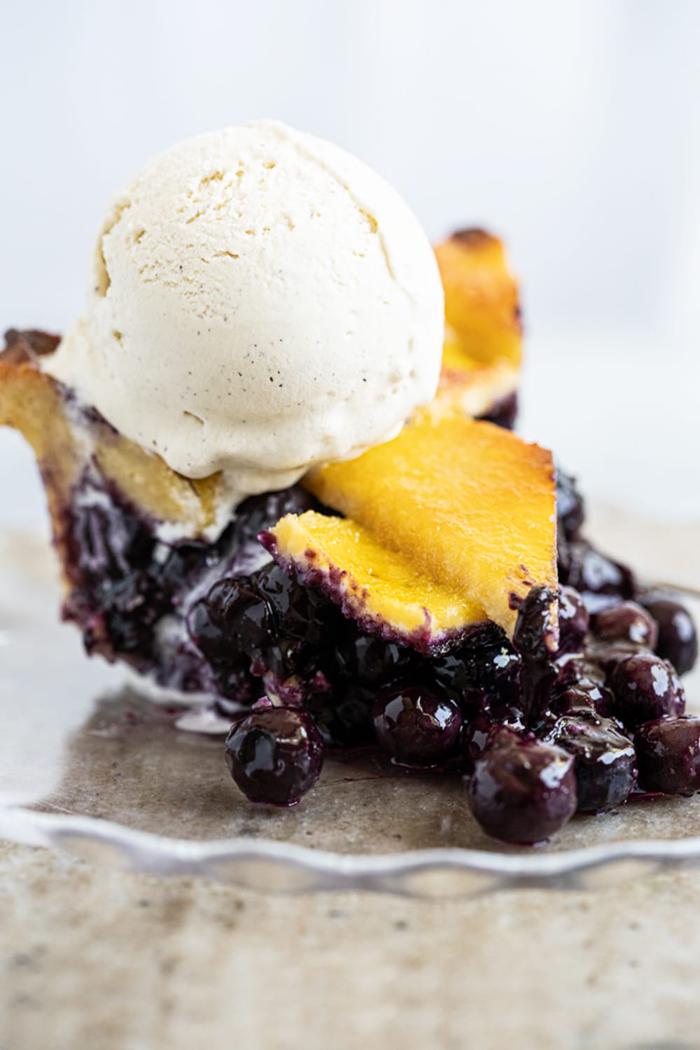 Gluten Free & Keto Blueberry Pie (with a flaky lattice pie crust!) and a scoop of vanilla ice cream on top