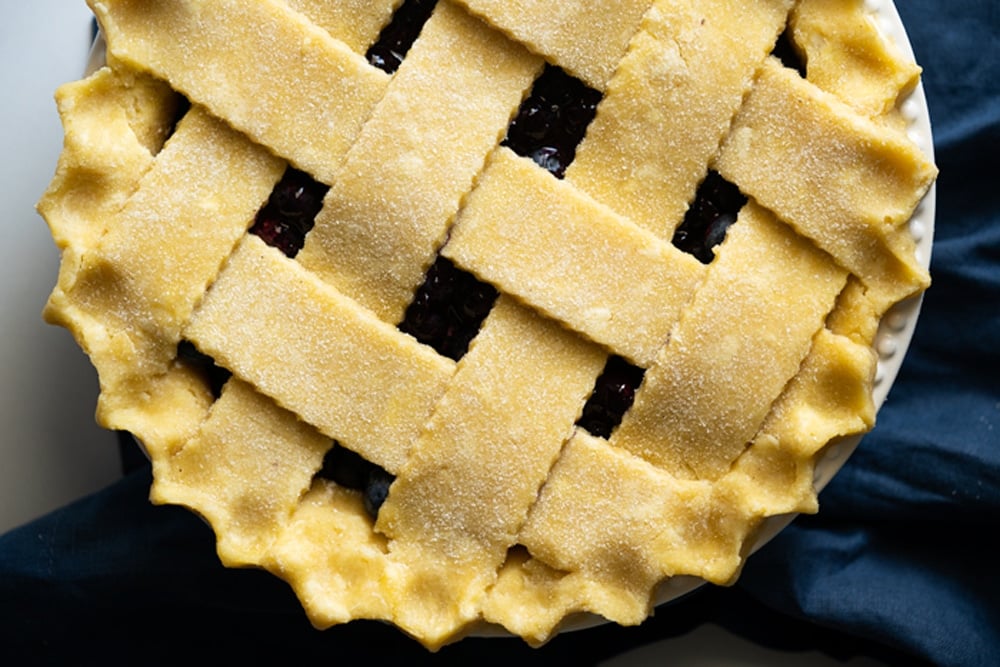 Overhead shot of a keto lattice pie crust with fluted edges