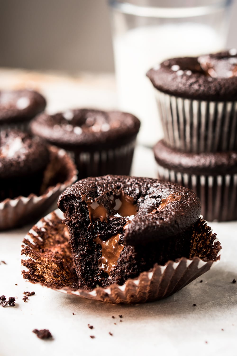 Keto chocolate muffin with a chunk bitten off