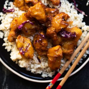 Keto orange chicken with sticky sauce served with cauliflower rice