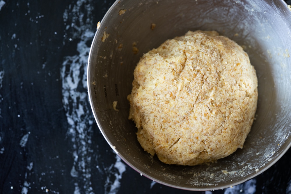 The keto shortcake dough rolled into a ball in a gray bowl