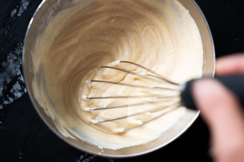 Whisking the pumpkin into the heavy whipping cream