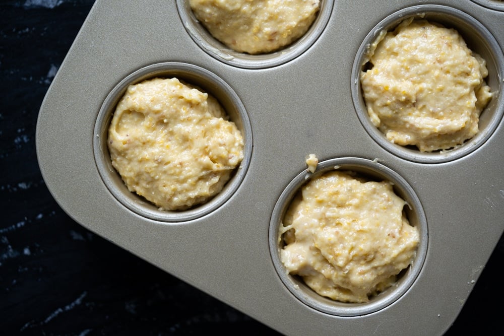 Unbaked low carb cornbread in a muffin tin