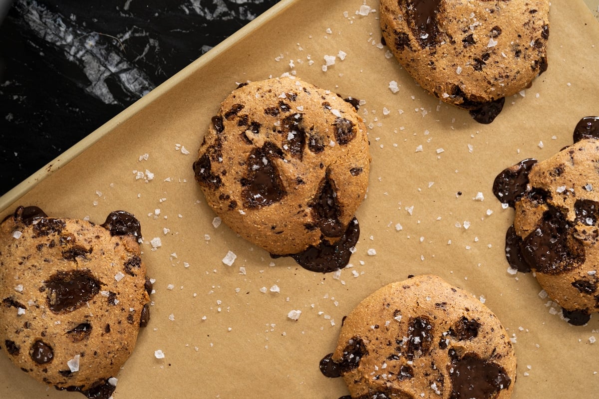 Freshly baked keto chocolate chip cookies on a baking tray