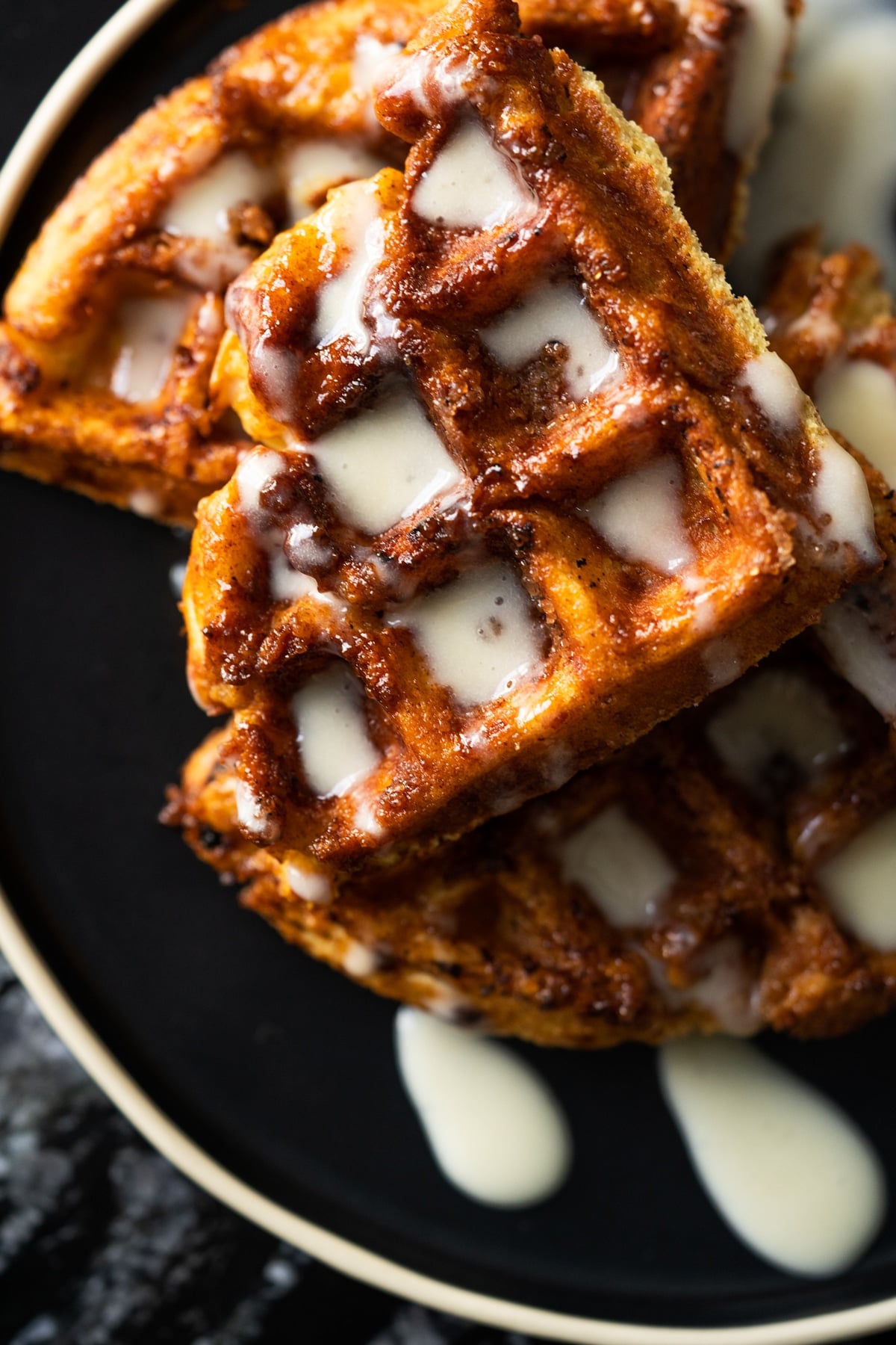 Keto sourdough cinnamon roll waffles with a cream cheese glaze