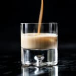 Pouring keto irish cream (i.e. a Baileys copycat!) onto a glass with ice