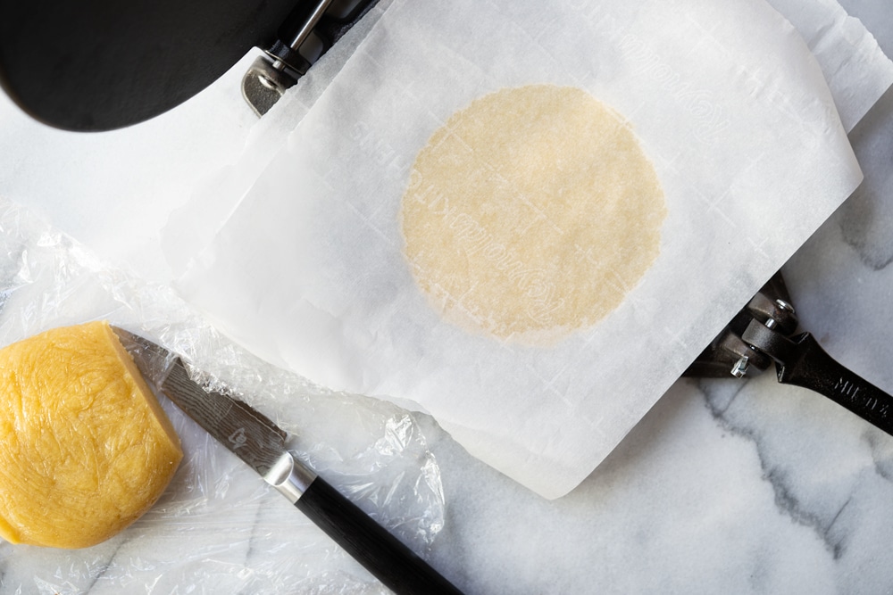 Rolling out the keto cereal dough with a tortilla press