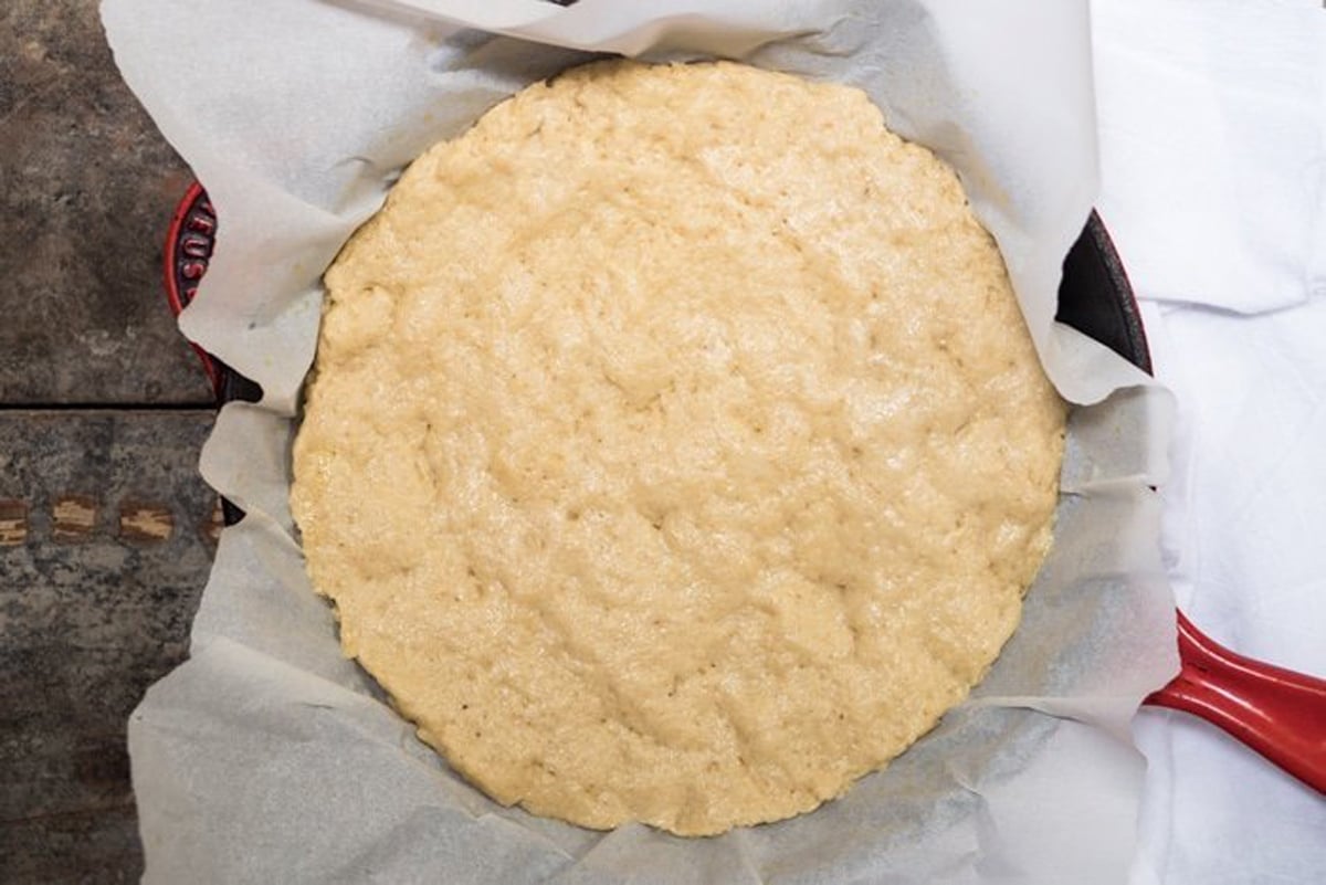 Unbaked keto pizza crust with yeast before rise