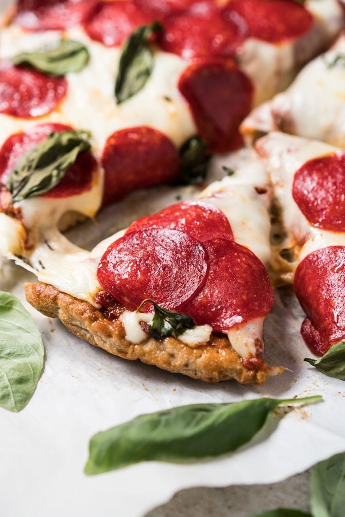 Keto pizza crust with marinara, mozzarella and pepperoni