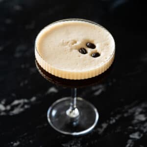 Sugar free & keto espresso martini garnished with three coffee beans