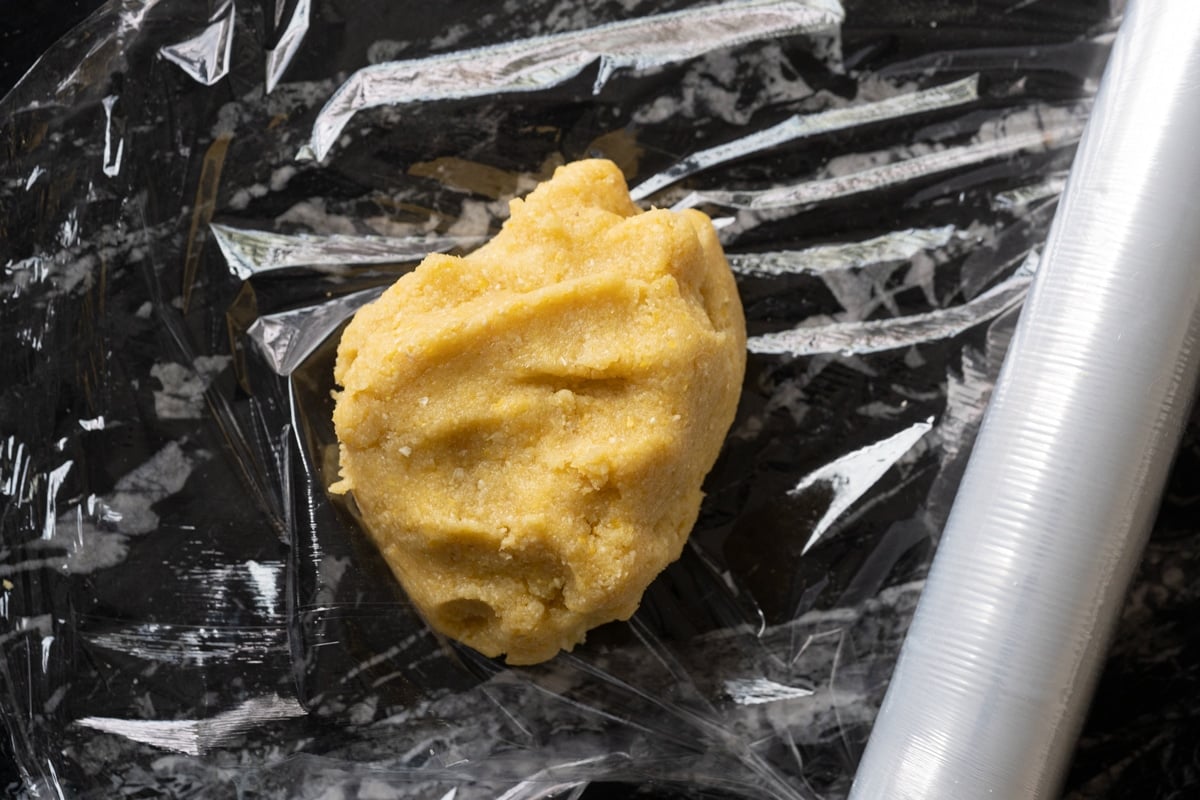 Low carb cornbread crisp dough getting wrapped in cling film