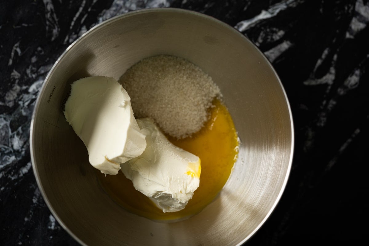 Overhead shot of the cream cheese filling with an egg yolk and sweetener
