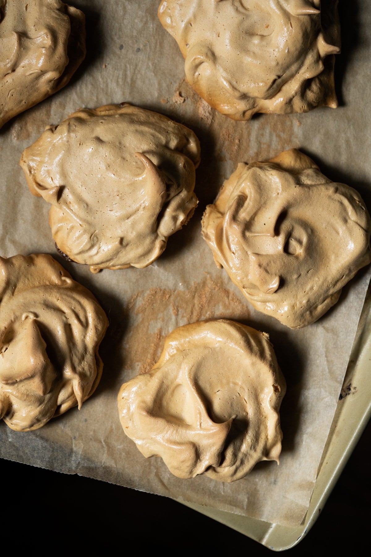 Freshly baked maple meringues on a baking tray