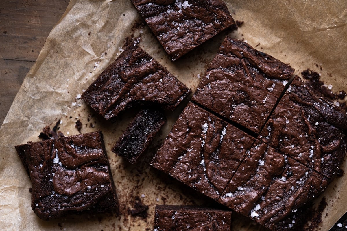 Freshly backed almond flour brownies garnished with flakey sea salt