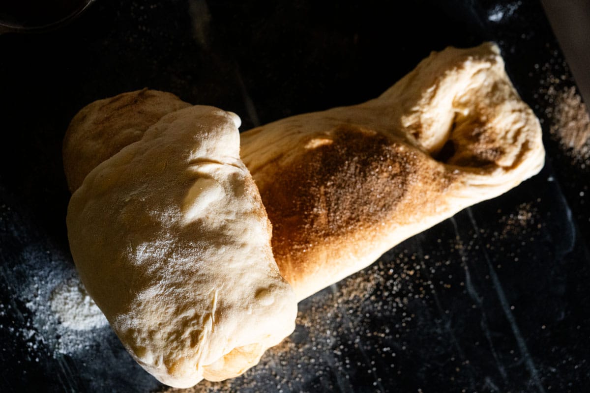 Rolling the laminated dough in order to shape it