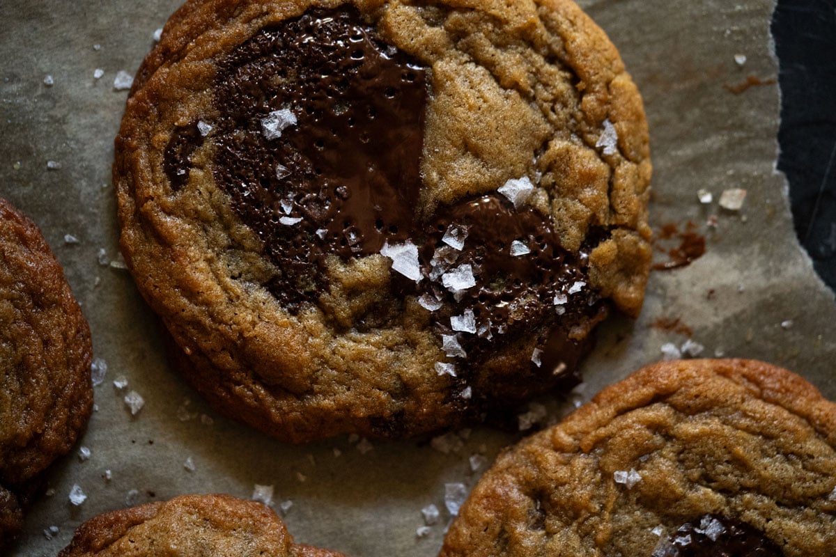 Close up of a puddle of melted chocolate in a sourdough fermented cookie