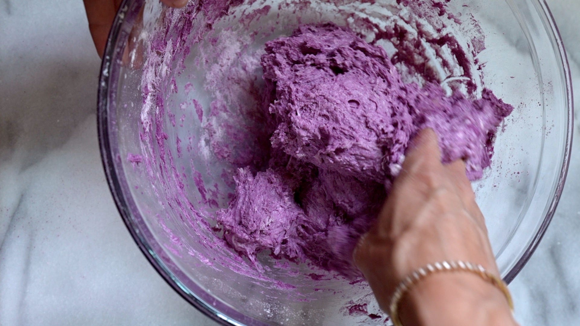Mixing the purple sweet potato into the sourdough bread mix